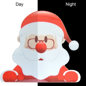 Santa Claus magnetic sticker showing day vs night reflective honeycomb texture effect