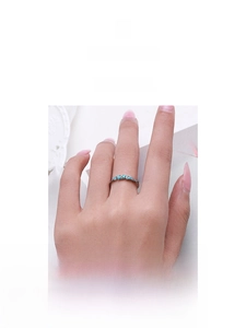Macro detail of S925 sterling silver ring featuring marquise-cut turquoise stone inlays