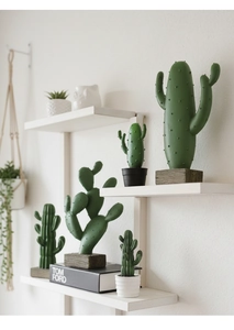 Detailed close-up of Nordic resin cacti decor with realistic textures on white shelves
