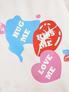 Detail of breathable white mesh fabric with Hug Me and Kiss Me heart print patterns