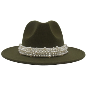 Close-up of dense white faux pearls on a dark olive green wide brim wool felt jazz hat