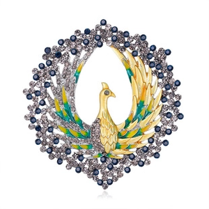 Detail of golden peacock brooch with colorful enamel wings and blue gemstone circular halo