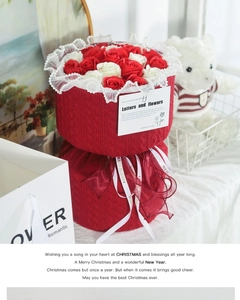 Detail of red and white soap flower bouquet in red knitted tweed wrap with ribbons