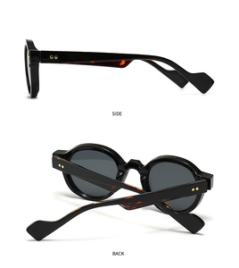 Detail view of vintage round sunglasses with gold star rivets and tortoise temples