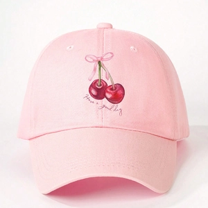 Detailed view of pink baseball cap with red cherry embroidery and have a good day slogan