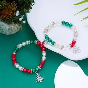 Detail view of Christmas magnetic bracelets with holiday beads and festive charms