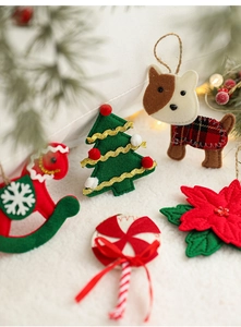 Detailed felt Christmas ornaments including dog and rocking horse on white fur background