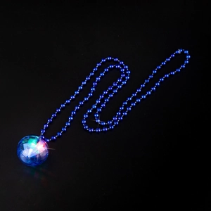 Close-up of glowing retro disco ball pendant on blue bead chain with multi-color light