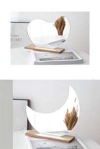 Irregular acrylic mirror on wood base with a heart shape aesthetic for desk decor