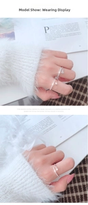 Detailed model show of open rings featuring sleek design and sparkling round stones