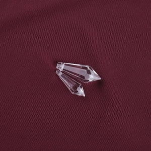 Macro view of teardrop crystal pendant with multifaceted cut and small top hole