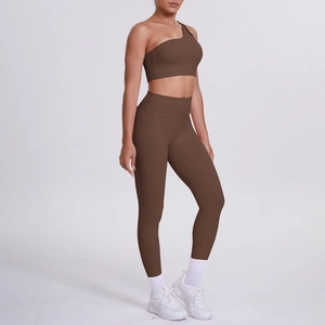 Close-up of dark coffee one-shoulder sports bra and high-waisted yoga leggings set