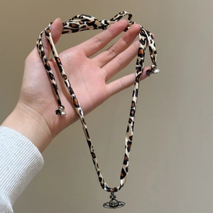 Retro leopard print ribbon necklace with vintage silver Saturn pendant for women