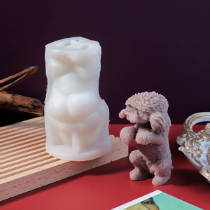 Detail of white silicone poodle candle mold showing realistic hair texture on a finished candle