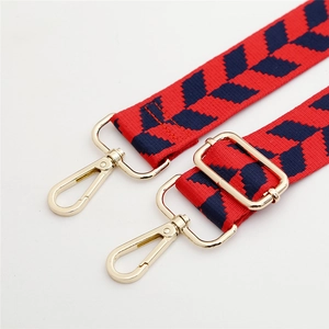 Adjustable red and navy jacquard nylon shoulder strap with gold metal hooks and buckle
