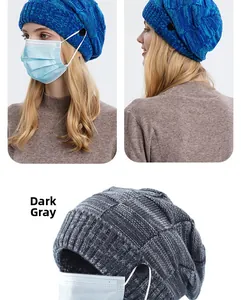 Detail of knitted beanie with side buttons for mask straps in blue and dark grey