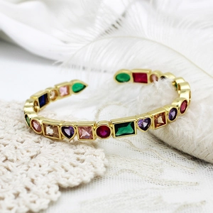 Detailed macro view of 18K gold-plated bangle featuring colorful heart and round zircon stones
