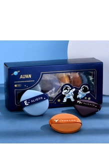 Detailed display of 7 assorted makeup sponges in a cosmic themed gift box