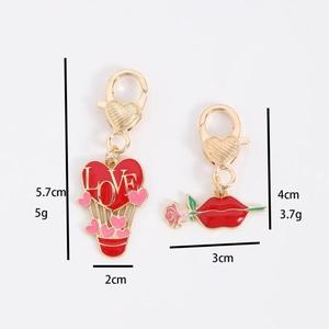 Pink heart balloon and red lip lobster clasp pendants with measurements and weight
