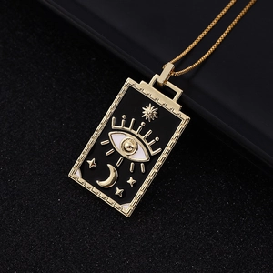 Vintage gold plated tarot pendant necklace with celestial moon and sun motifs