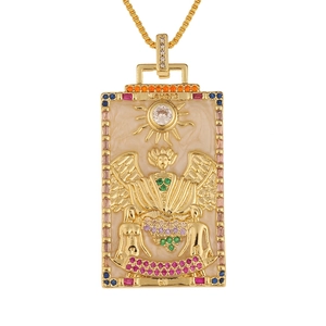Detailed close-up of The Lovers tarot card gold pendant with colorful zircon stones
