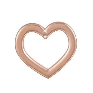 Macro shot of rose gold heart-shaped stainless steel jewelry pendant with dual holes