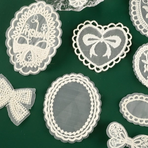 White embroidered lace patches in heart and bow shapes for DIY sewing decoration