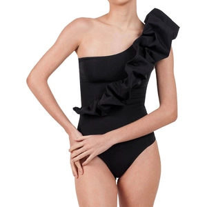 Detail of elegant black one-shoulder swimsuit with asymmetrical ruffled layers and slim fit