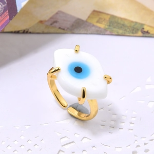 Adjustable gold plated evil eye ring with blue glass inlay in bohemian style