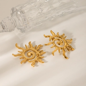Minimalist gold spiral sun stud earrings with textured abstract rays for women