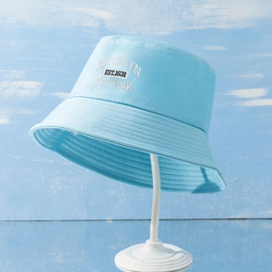 Detail view of Brooklyn embroidery on light blue cotton canvas bucket sun hat