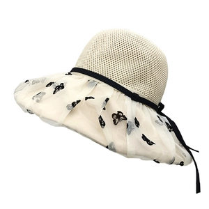 Chic beige straw sun hat with wide lace brim and black butterfly embroidery accents