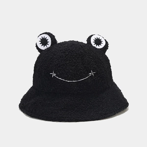 Detail of black fleece frog bucket hat with embroidered big eyes and star-dotted smile