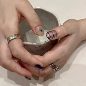 Handmade press-on nails with metal star patterns and aurora mirror finish