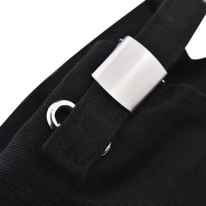 Detailed close-up of the adjustable silver metal buckle and reinforced eyelet on baseball cap