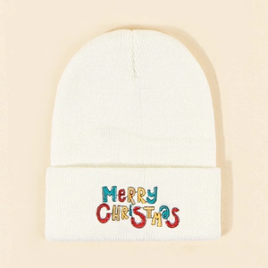 White knit beanie with colorful Merry Christmas embroidery and a minimalist festive design