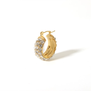 Close-up of a luxury 18K gold-plated hoop earring with multiple rows of sparkling crystals