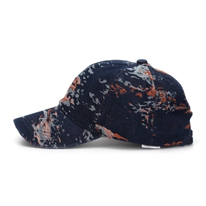 Close-up of abstract jacquard camo texture on navy blue baseball cap with fine stitching