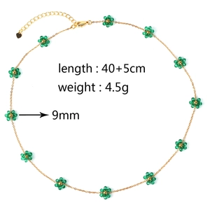 Detail view of gold flower necklace showing length 40+5cm, weight 4.5g and 9mm bead size