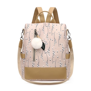 Waterproof floral Oxford backpack for women with plush ball charm and anti-theft design