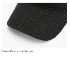 Macro shot of dark grey striped baseball cap featuring a thick reinforced structured brim