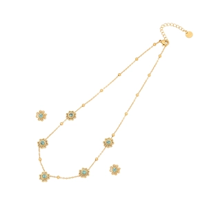 Vintage gold turquoise necklace set with small floral pendants on a clean white background