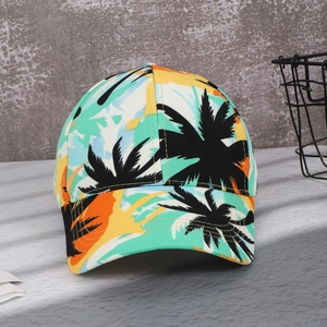 Close-up of tropical print baseball cap with vibrant orange and green floral patterns