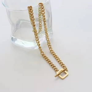 Minimalist gold stainless steel link chain necklace featuring a punk style square toggle clasp