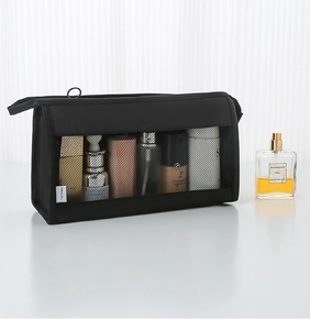 Detail view of black mesh travel toiletry bag showing spacious interior for cosmetics