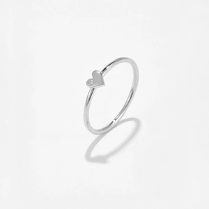 Macro shot of minimalist S925 sterling silver heart ring with a small zircon stone
