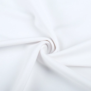 Detailed macro view of pure white elastic fabric texture and smooth draped folds