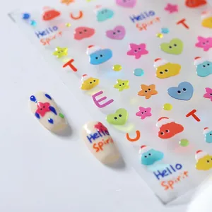 Detail of colorful cartoon nail stickers featuring hearts and stars with macro view