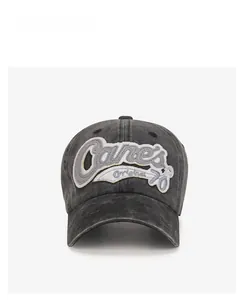 Detail of vintage washed charcoal baseball cap featuring Canes Original 70 patch