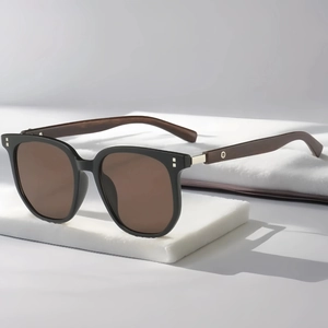 Detail of vintage square sunglasses with dark brown wood grain temples and metal rivets